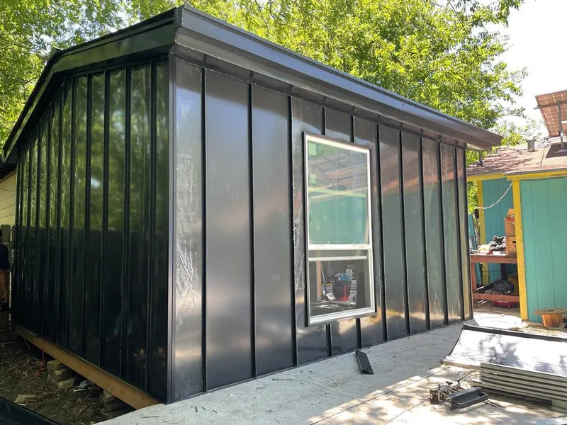 Black standing seam metal wall panels for Roof Inspection in Heber Springs