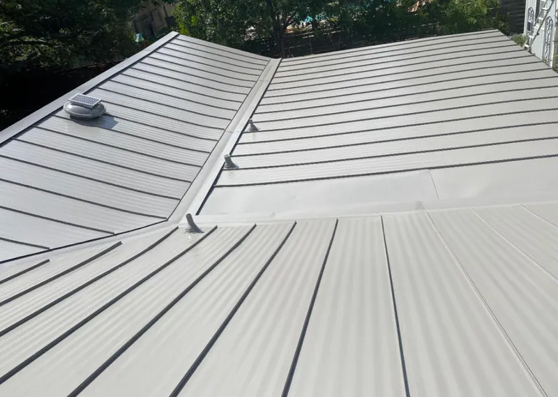 Solar attic fan installed on a metal roof for Roof Ventilation in Heber Springs